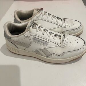 White Reebok ladies sneakers.